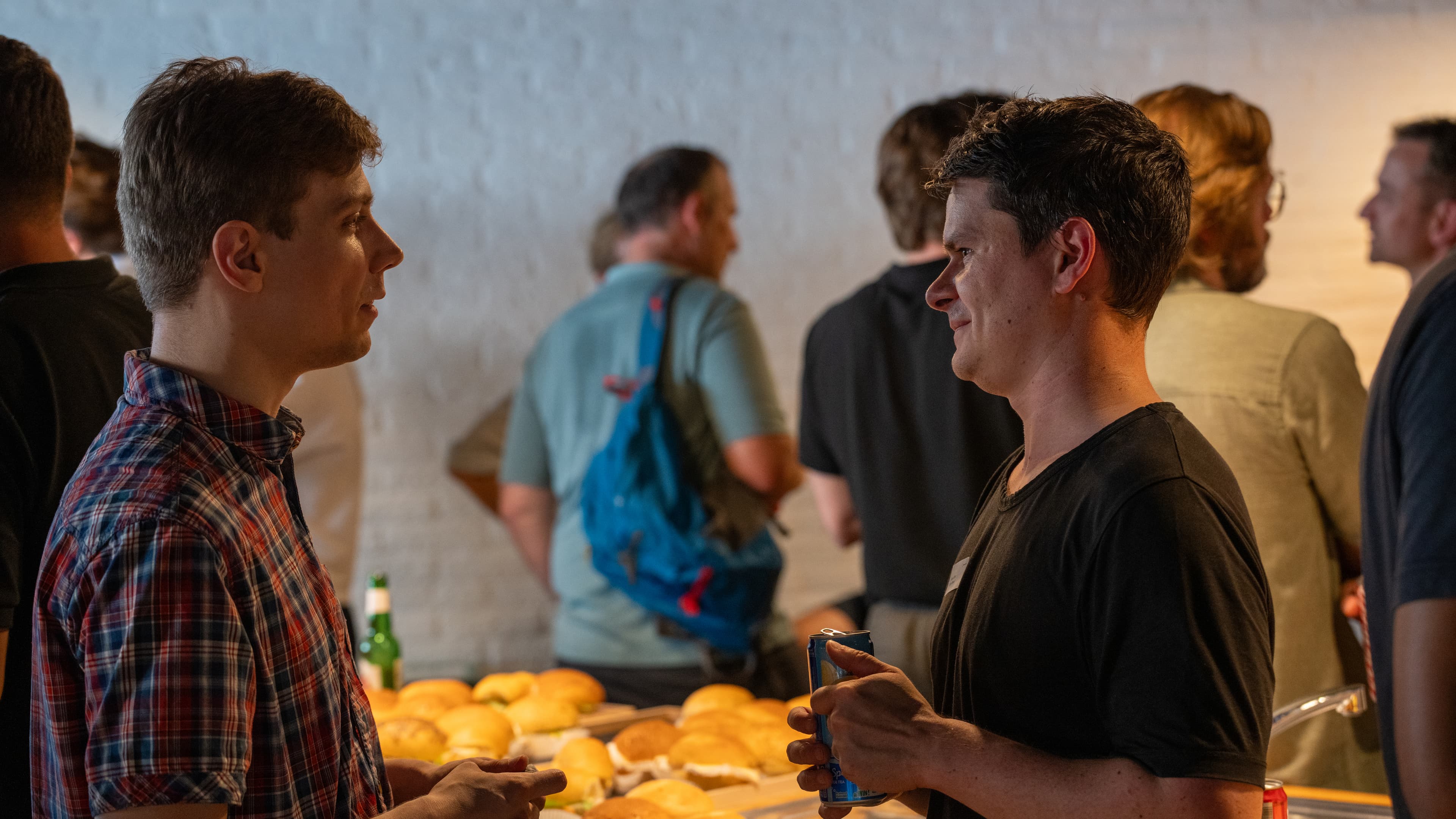 Two attendees in conversation during the networking session.