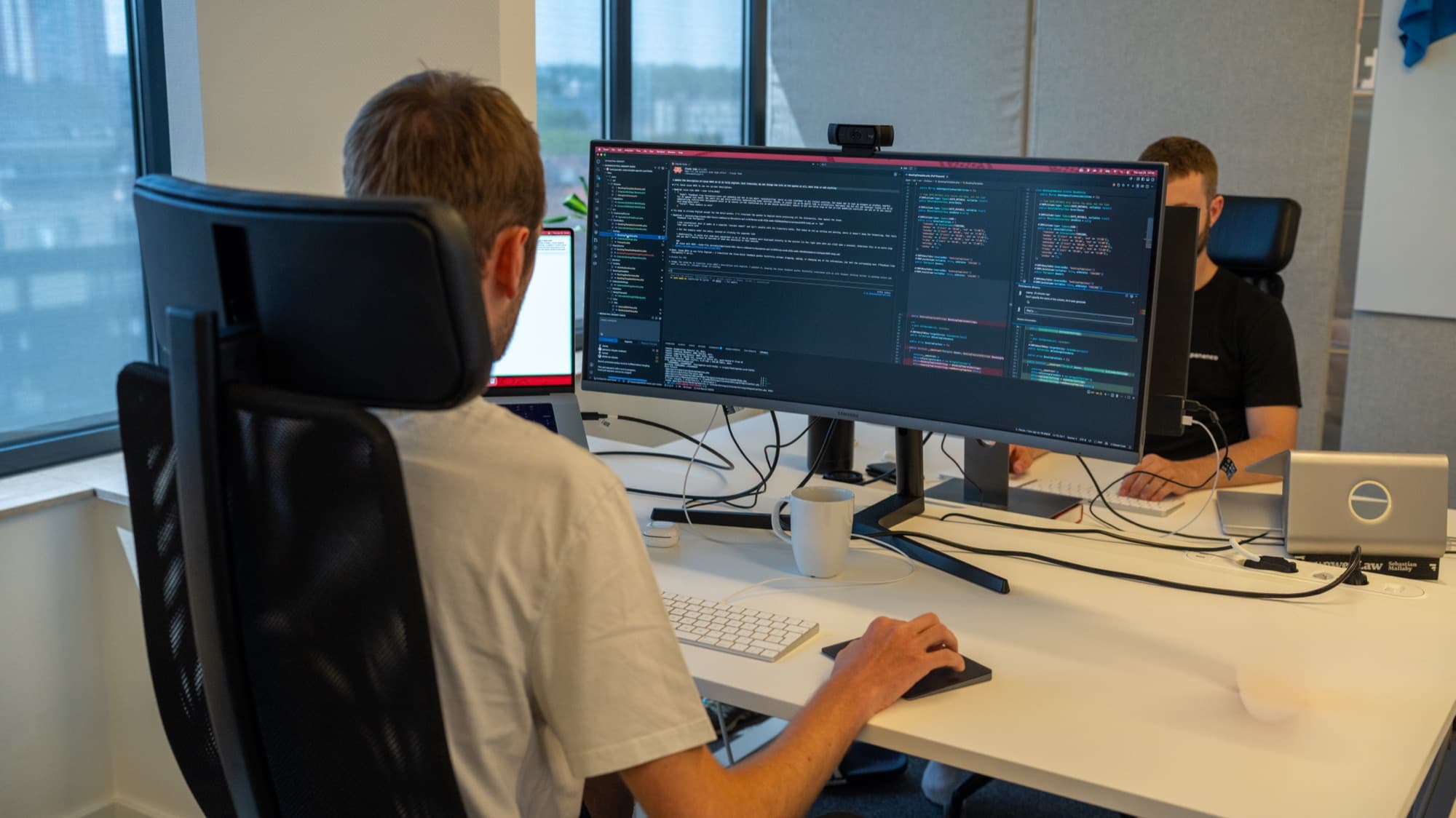 Panenco engineers collaborating at their workstations